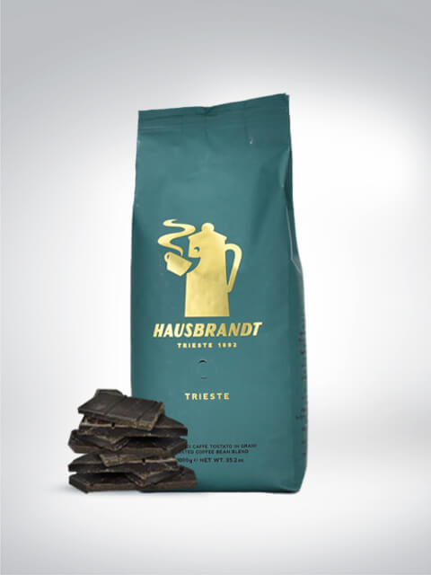 Package of Hausbrandt Trieste coffee next to dark chocolate