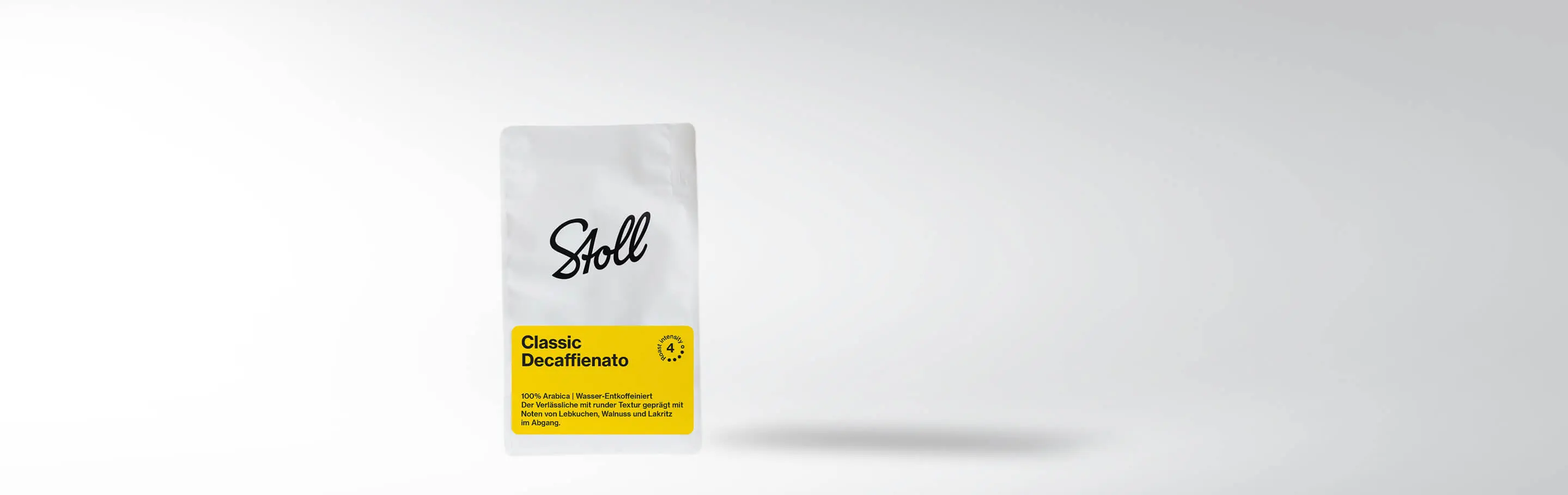 A coffee package 'Classic Decaffienato' by Stoll with a yellow label