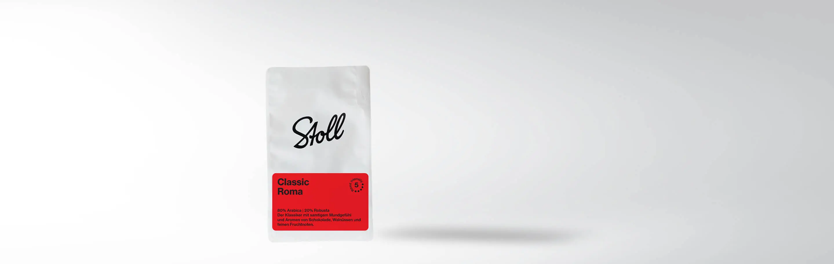 Packaging of Stoll Coffee Classic Roma with 80% Arabica and 20% Robusta, smooth mouthfeel and aromas of chocolate, walnuts, and fine fruit notes.